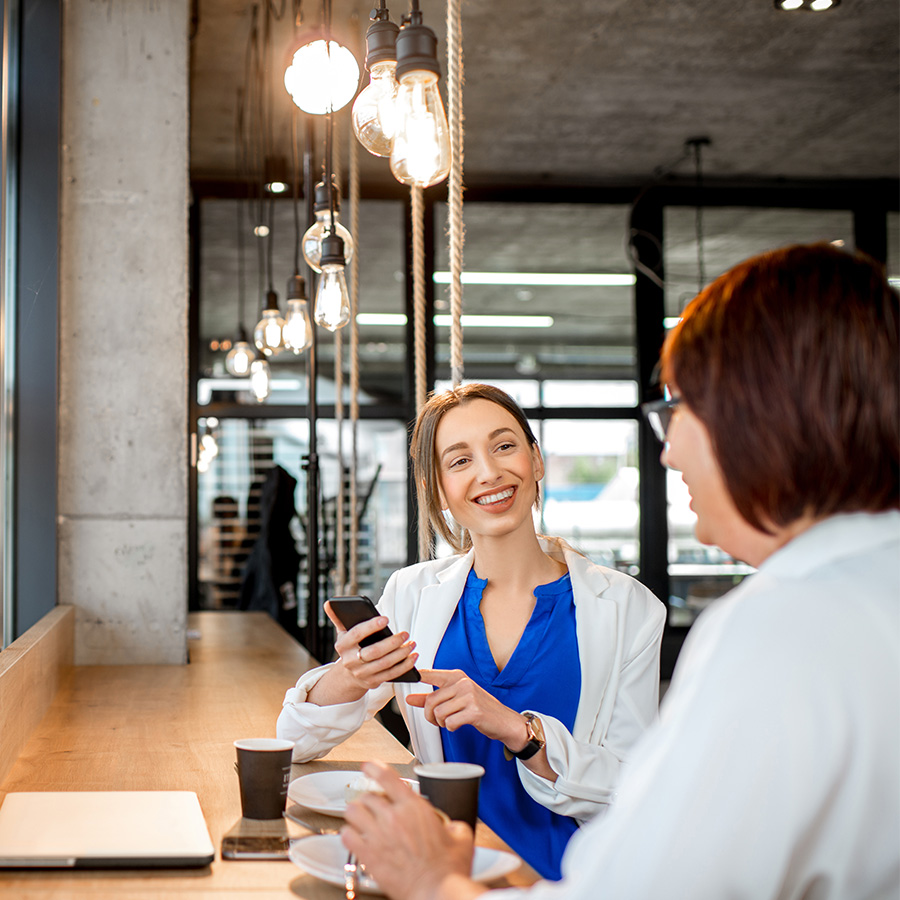 business women sitting in the cafe 5TLD5K3